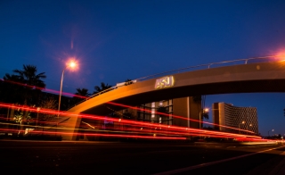 ASU pedestrian bridge at night.