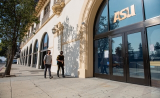 Two people walking outside ASU building in downtown Los Angeles