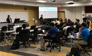 Doug Bingham, senior director of manufacturing technology for Honeywell and guest lecturer, discusses additive manufacturing concepts with a class of engineering students at the Polytechnic campus.