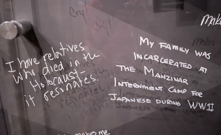 Photo of a panel where people wrote about their family's history