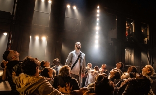 Jack Hopewell and the company of the North American Tour of "Jesus Christ Superstar" performing on stage.