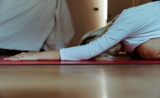 young woman in yoga child's pose