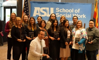 Winners of 2023 ASU Social Work Month Awards post for a photo with their awards.