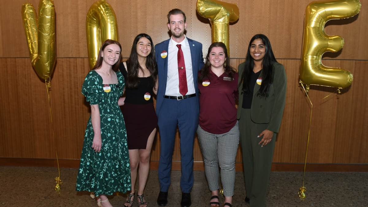 ASU student government council of presidents pose for a group photo at a reunion event.