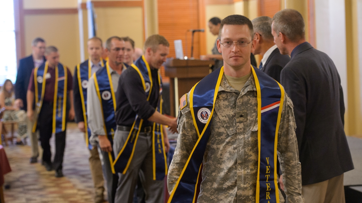 graduating ASU veteran students attending a reception