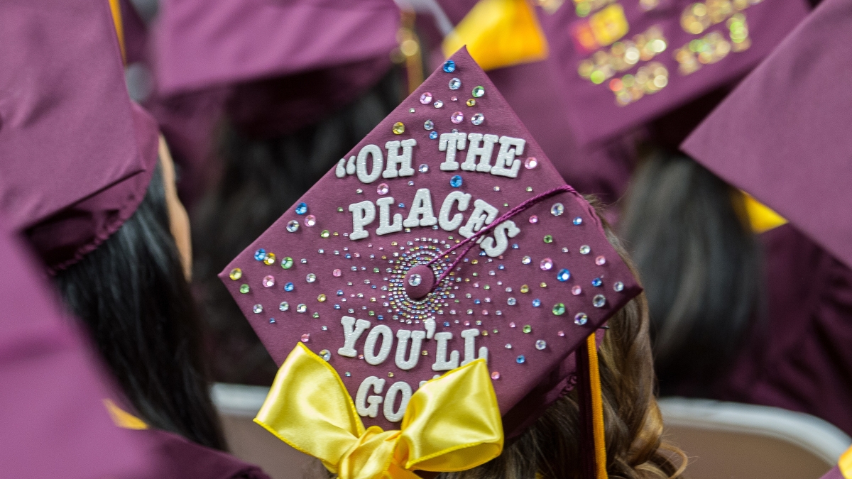 close-up of graduation cap that says "Oh the places you'll go"