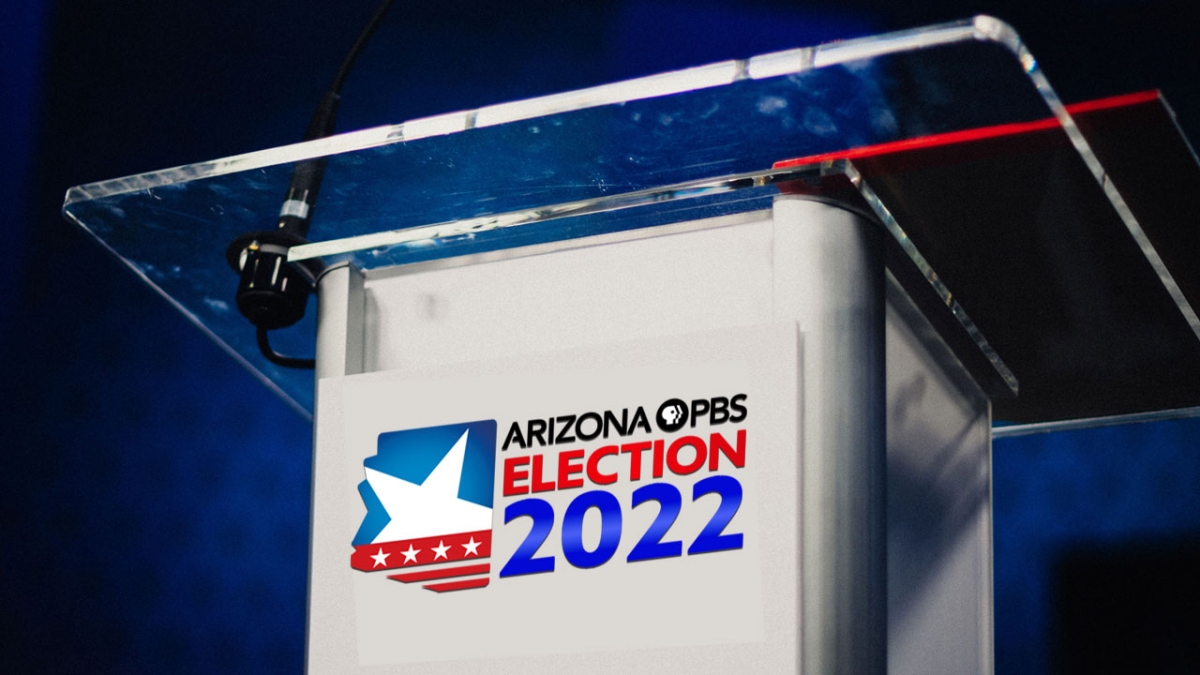 Debate podium decorated with a logo that reads "Arizona PBS Election 2022"