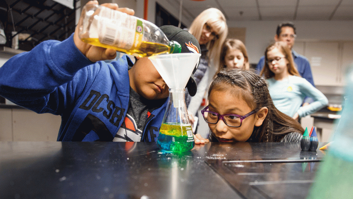 Children make a lava lamp in a lab