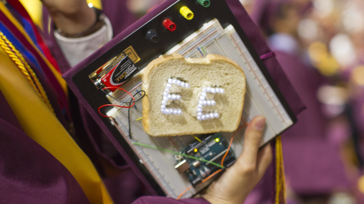 An asu grad's mortarboard is decorated as a breadboard.