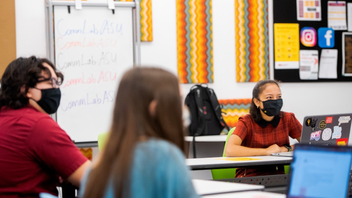 masked students in a socially distanced classroom