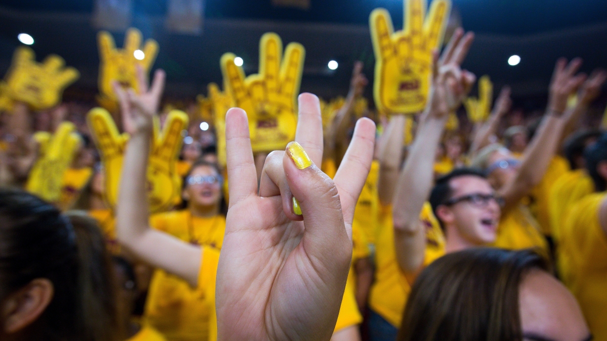 Students celebrating and making a pitchfork sign with hands at ASU Fall Welcome