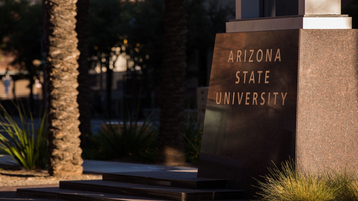 The base of a campus sign that reads Arizona State University