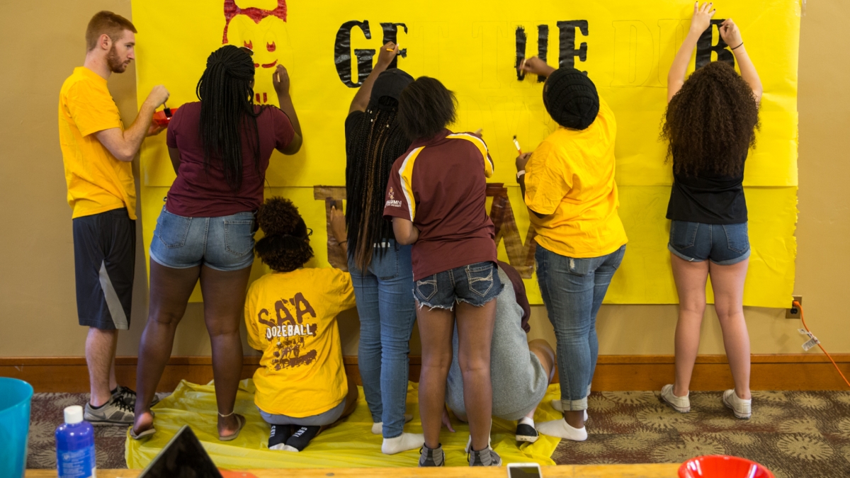 SAA game banner being painted