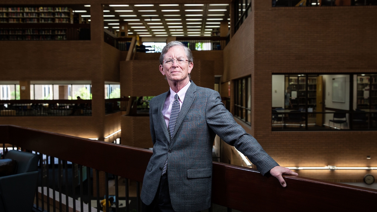 University Librarian Jim O'Donnell poses for a portrait on the second floor of Noble Library