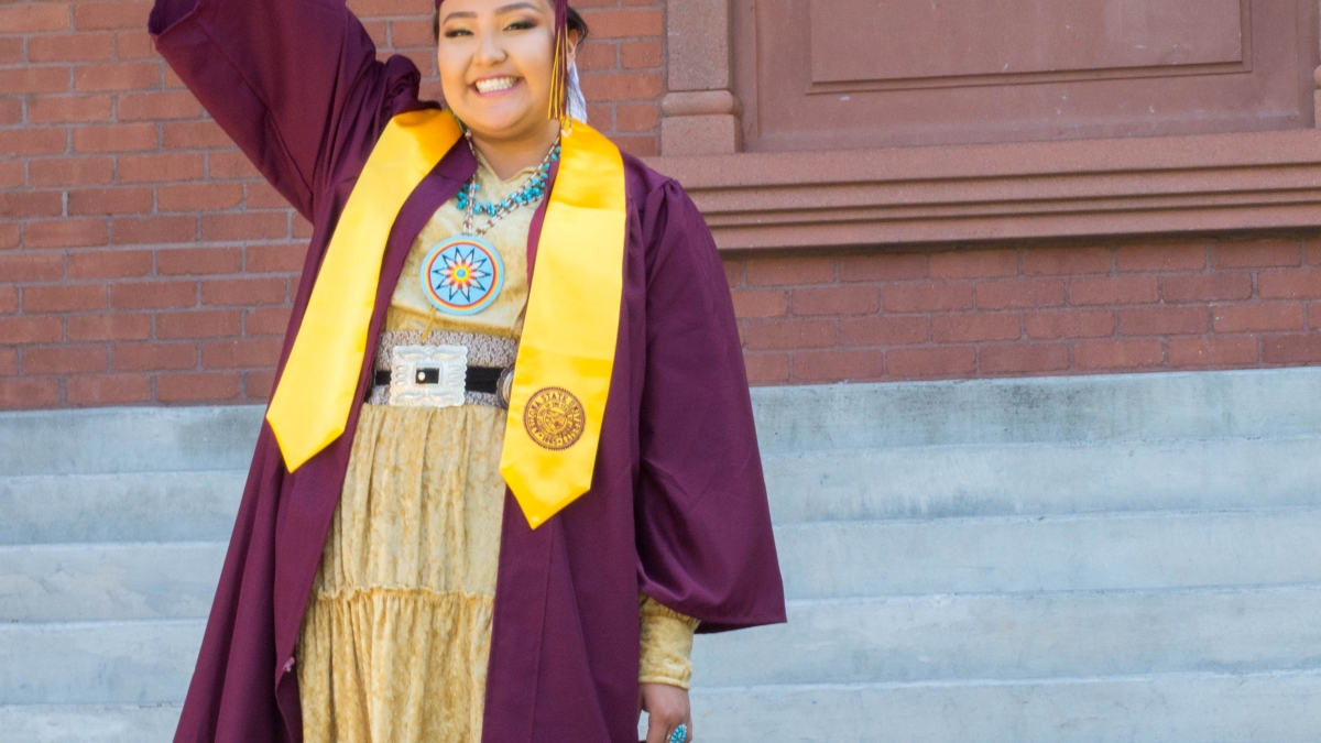 ASU graduate Christina Haswood poses outside Normal School