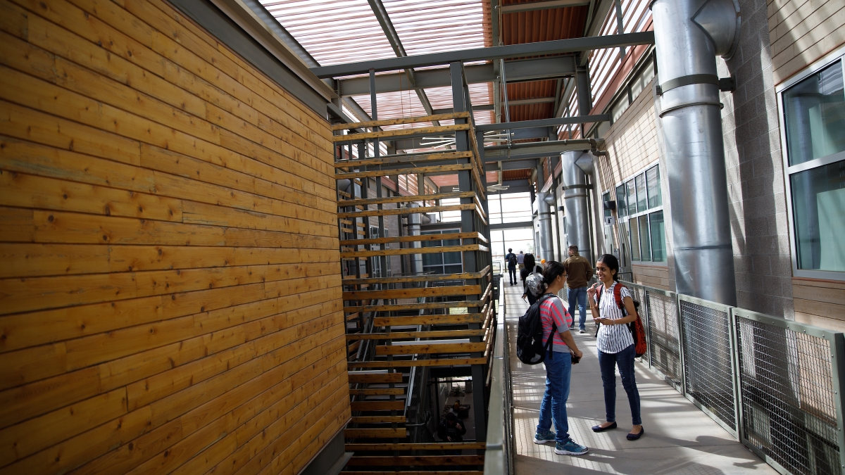 students in building breezeway on Polytechnic campus