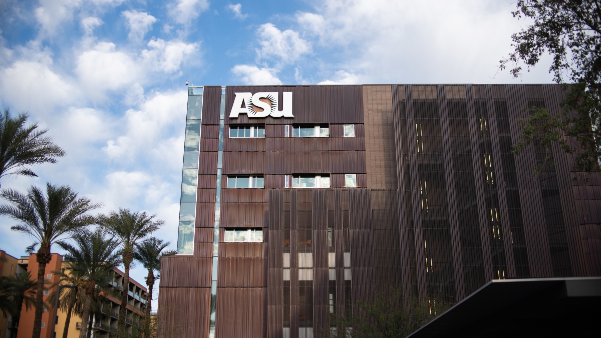 A multistory building with an ASU sign near its top