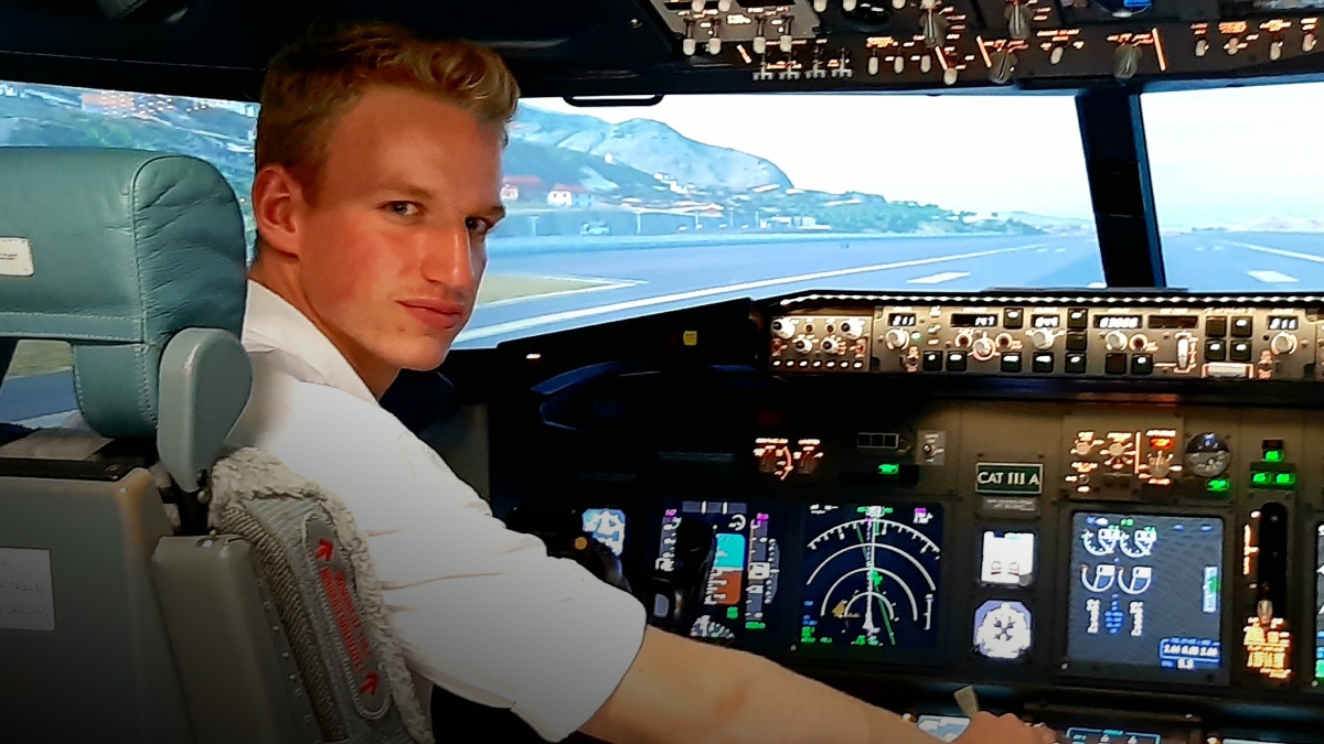 man sitting in cockpit of plane