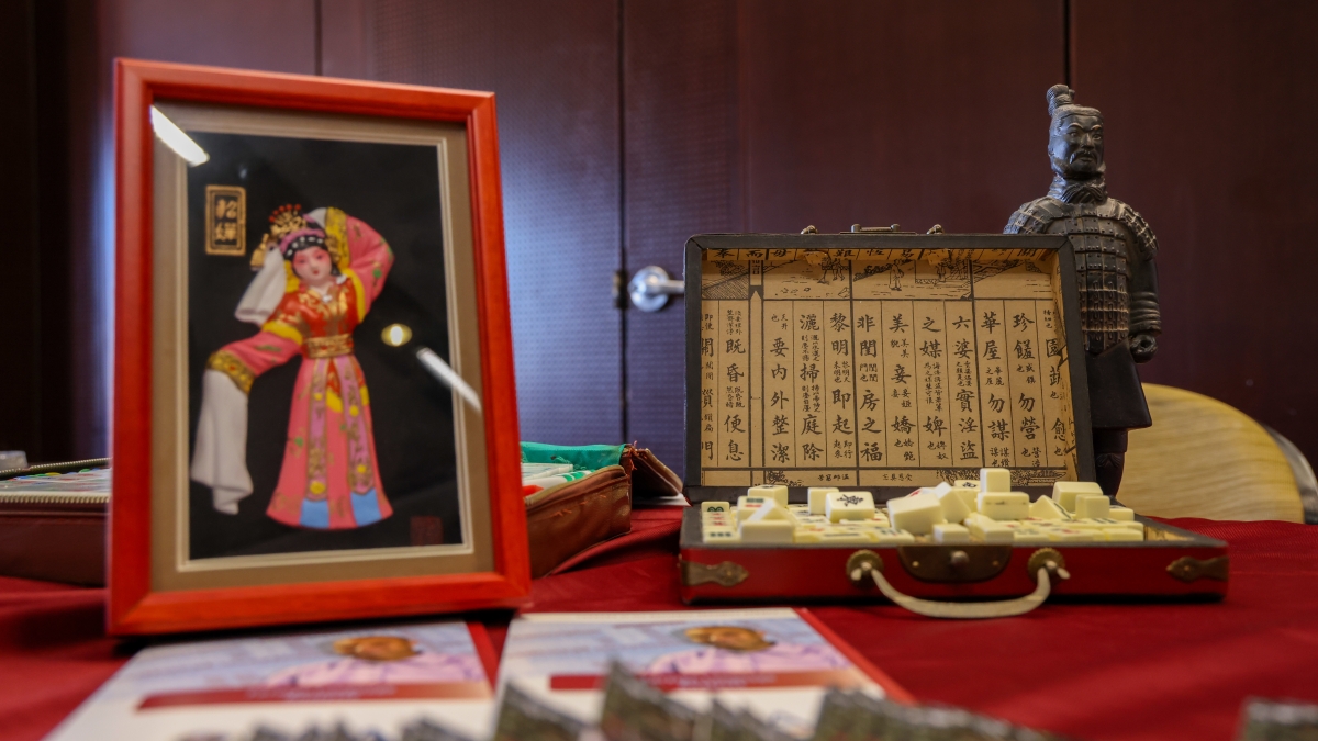 Chinese display at International fair showing various cultural items.