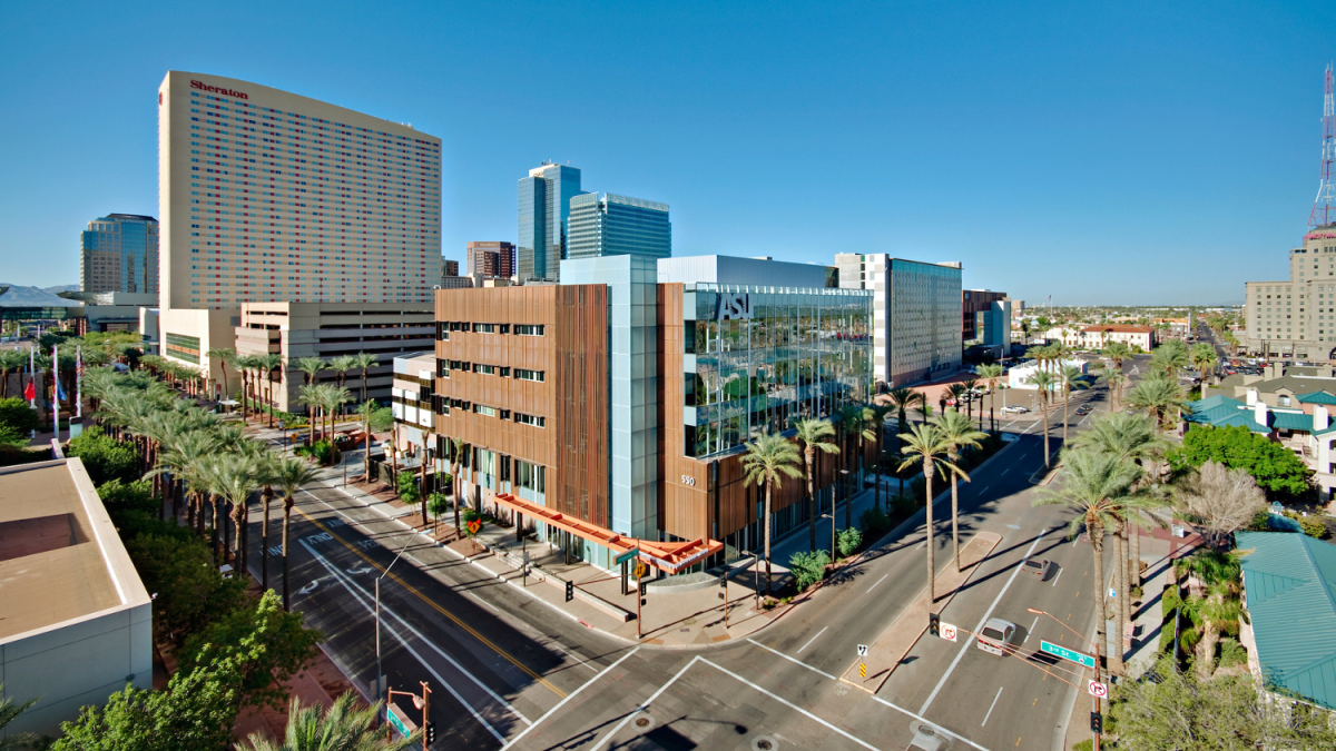 ASU's Health North Building is seen in the foreground with Downtown Phoenix in the background on a sunny day.