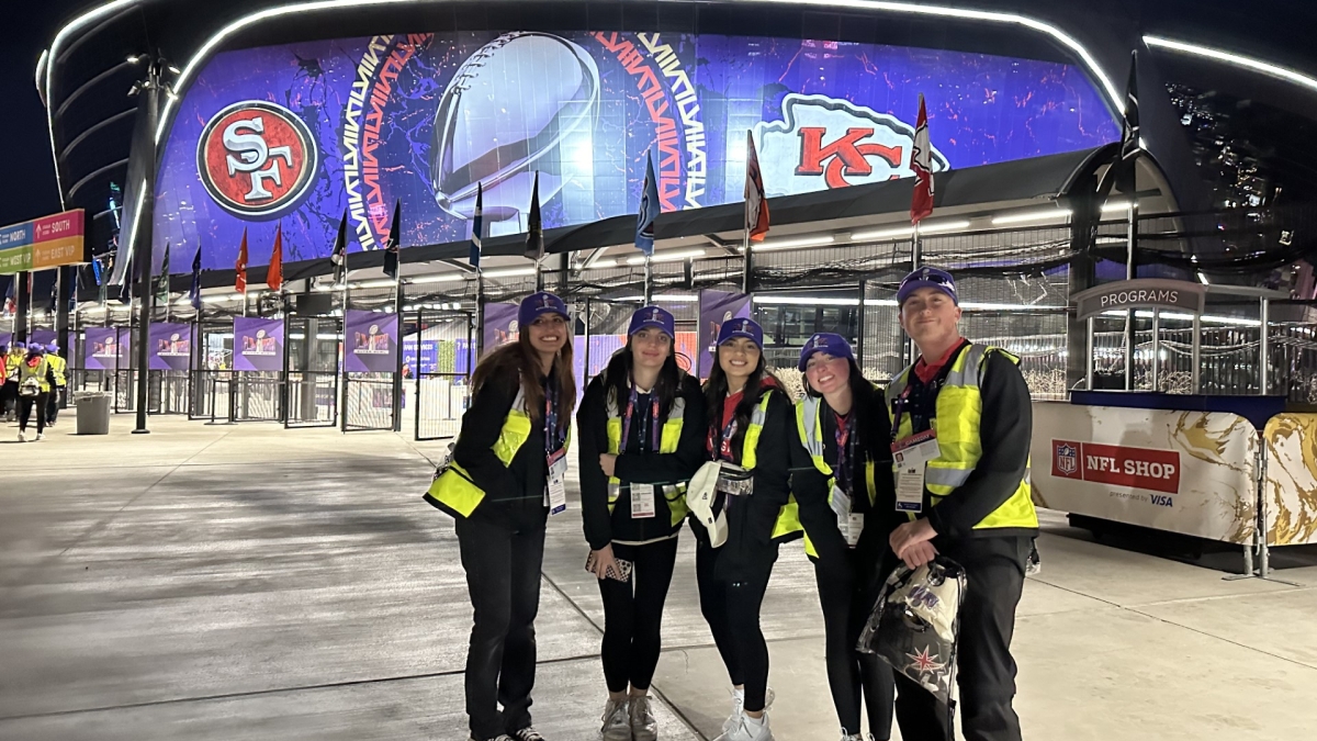 Five students stand in front of Allegiant Stadium in Las Vegas.