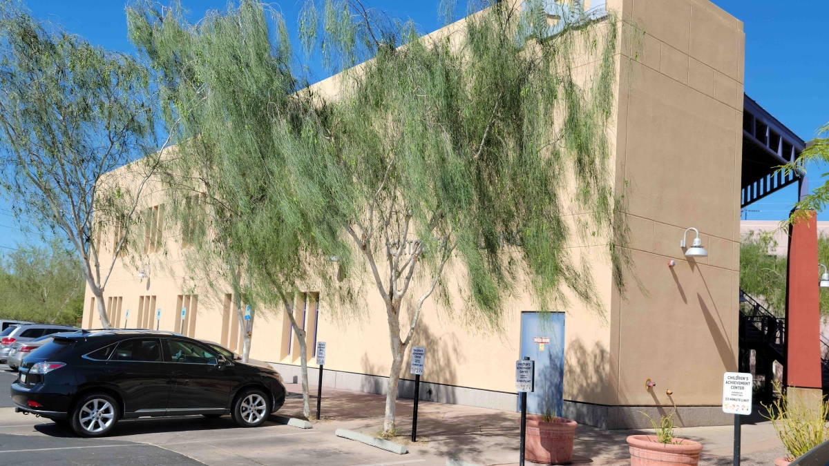 Exterior of ASU building and surrounding trees and parking lot