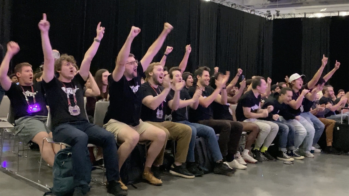 Adam Doupé and the Shellphish team cheer from their seats in the Las Vegas Convention Center.