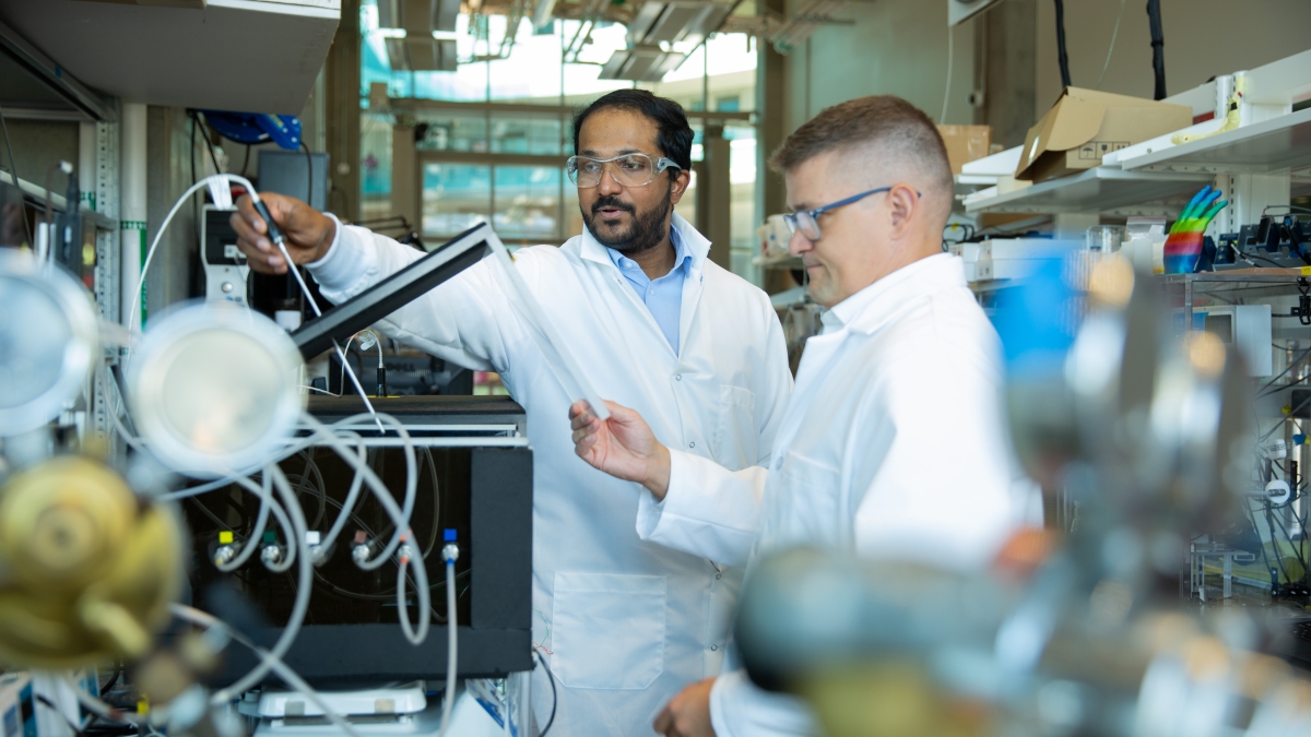 Mani Modayil Korah (left), a Science and Technology Center postdoctoral fellow, and Matthew Green (right), an associate professor of chemical engineering and director of the Center for Negative Carbon Emissions in the School for Engineering of Matter, Transport and Energy, part of the Ira A. Fulton Schools of Engineering at Arizona State University, conduct research in the Julie Ann Wrigley Global Futures Laboratory. Korah and Green received support from the U.S. Department of Energy to develop innovative c