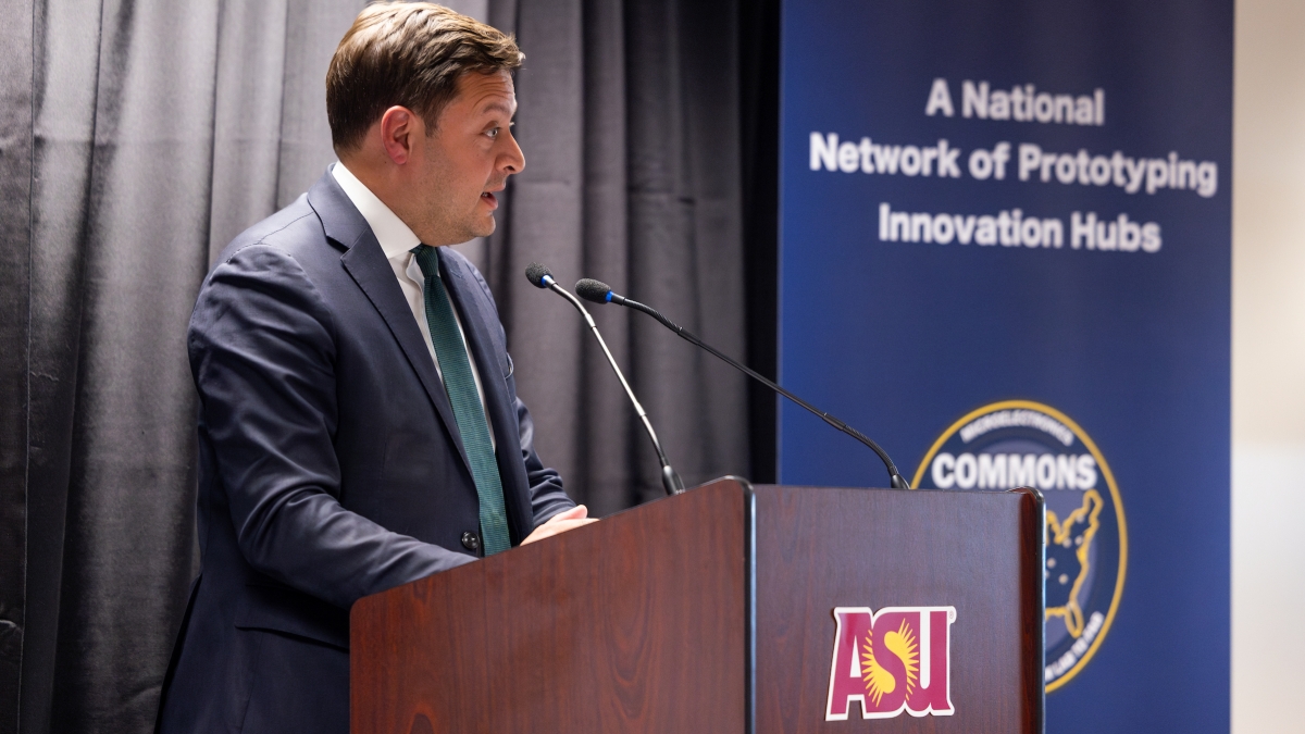 Man speaking at a podium.