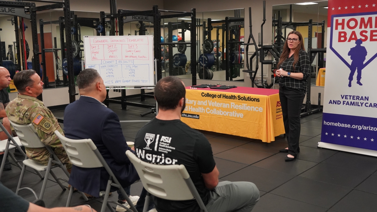 Rachel Larson talks to the first graduating cohort for the Home Base Warrior Health and Fitness Program