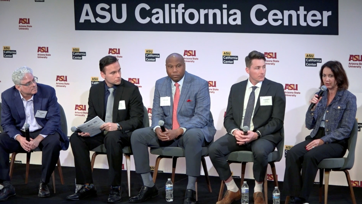 Group of five panelists sitting on stage holding microphones in front of sign that says ASU California Center