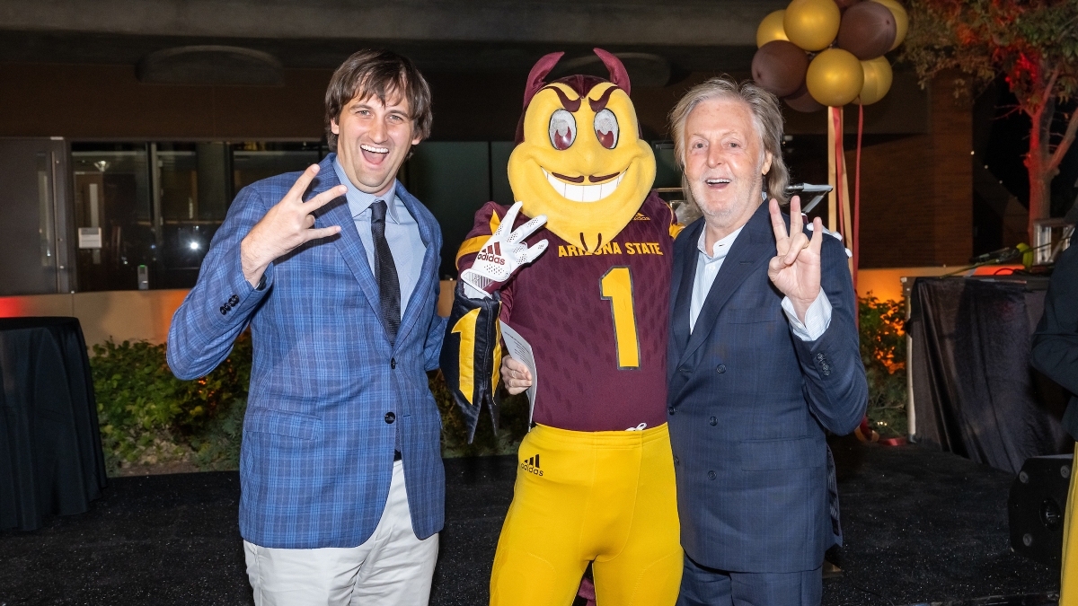 Two men and Sparky make the ASU pitchfork symbol with their hands.