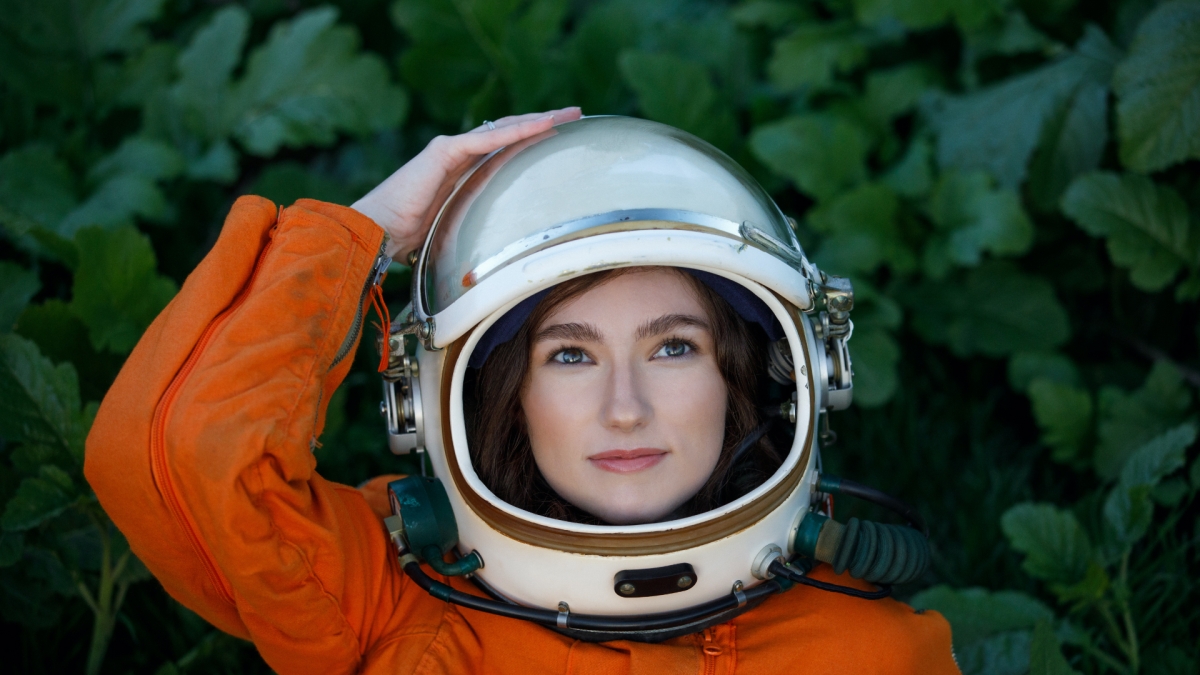 Emily Karlzen wearing a space helmet