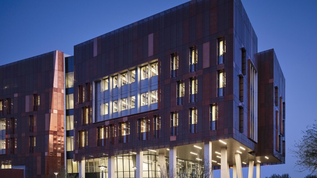 Exterior of the Biodesign Institute Building C pictured against a dark blue sky.