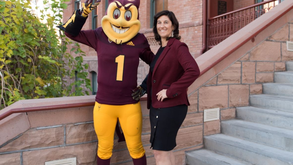 Alissa Serignese and Sparky on the steps of Old Main at ASU's Tempe campus.