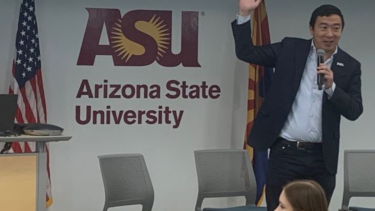 Andrew Yang speaking into a microphone at ASU event