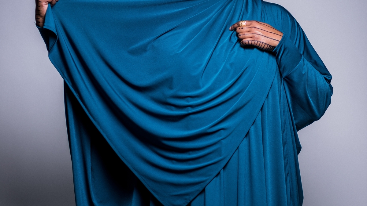 Angelica Lindsey-Ali poses in blue garment and hijab