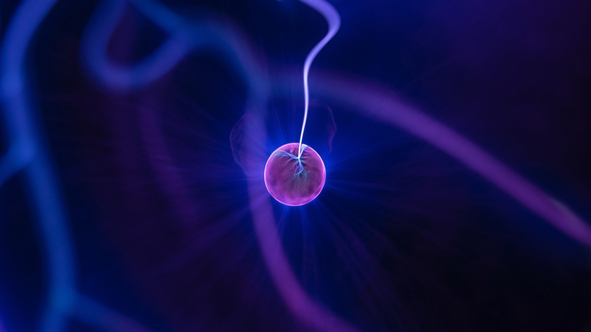 Illustration of a pink ball in blue waves of energy.