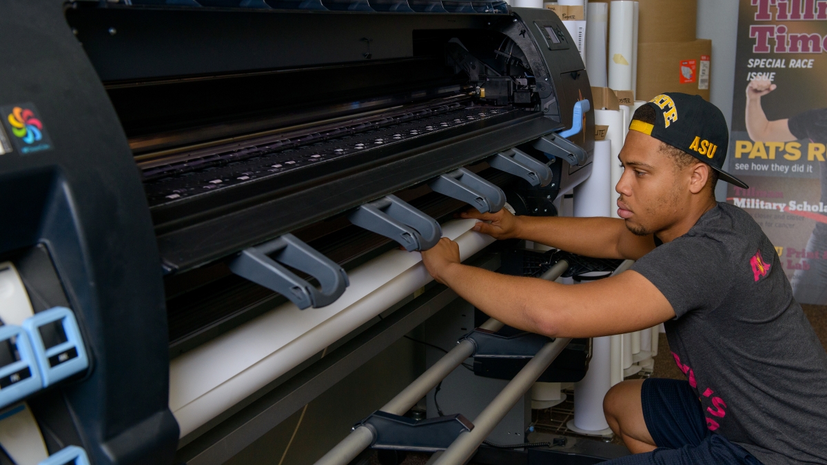 Student worker in ASU Print and Imaging Lab