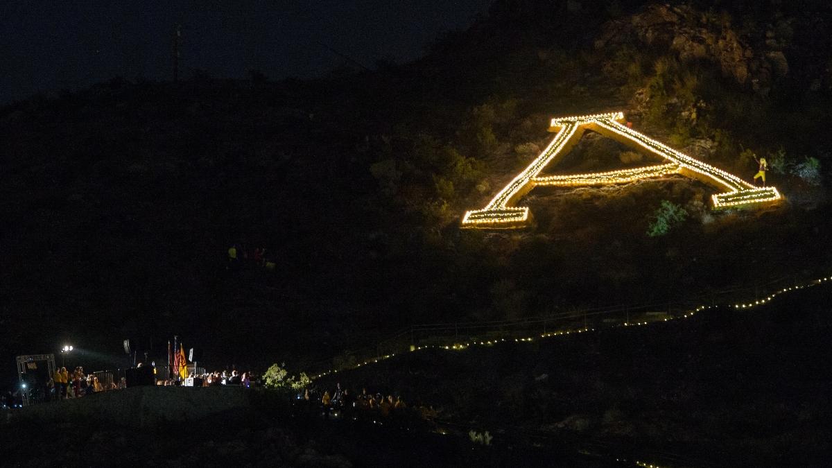The A on A Mountain is outlined with lights held by students during the Lantern Walk