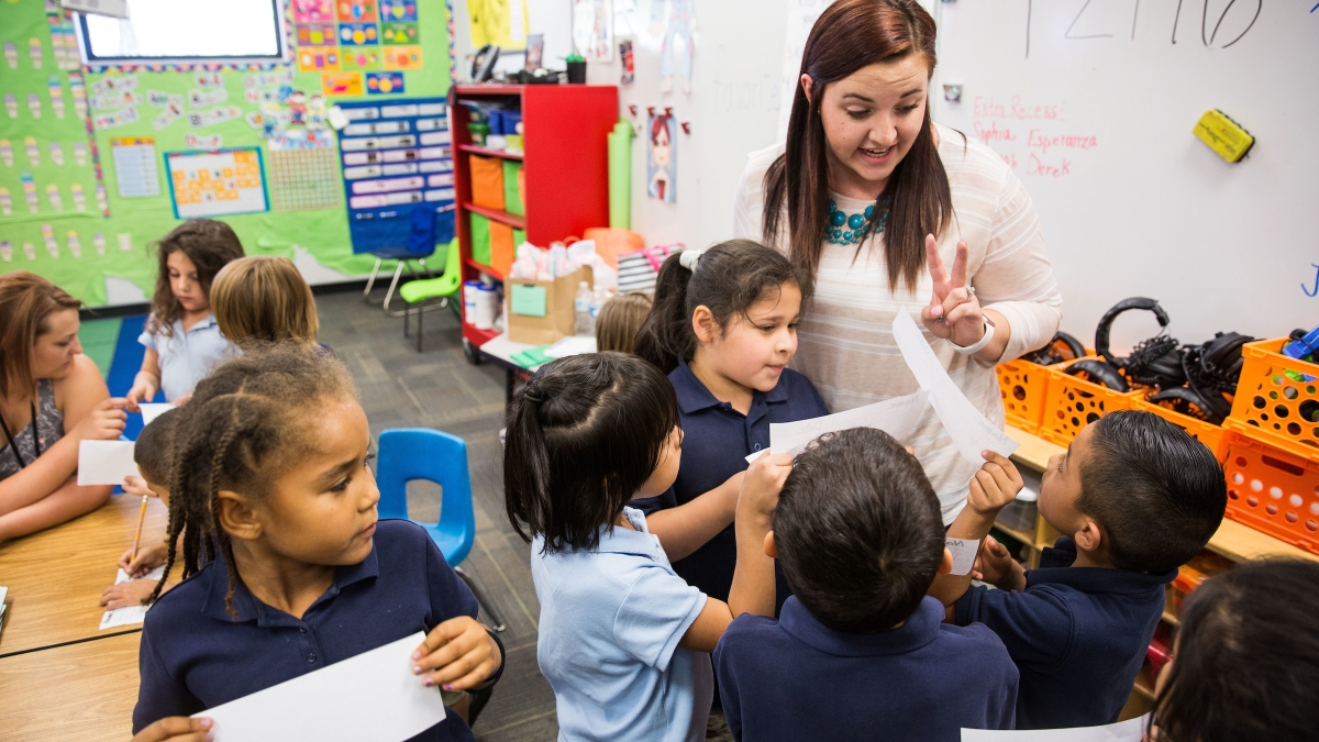 Teacher with students in a classroom