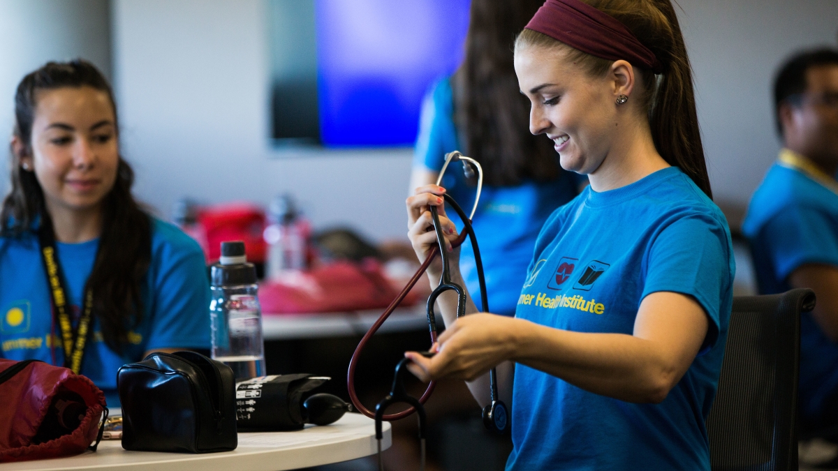 student holding a stethoscope