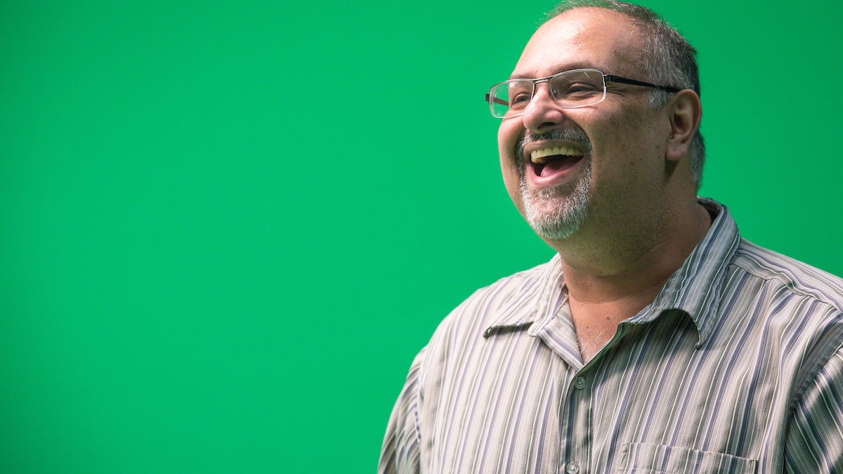 Man with green screen in the background