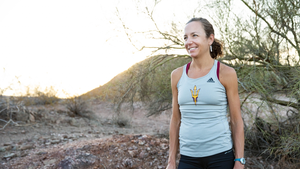 woman wearing a Sun Devil Athletics branded tank top in a nature setting