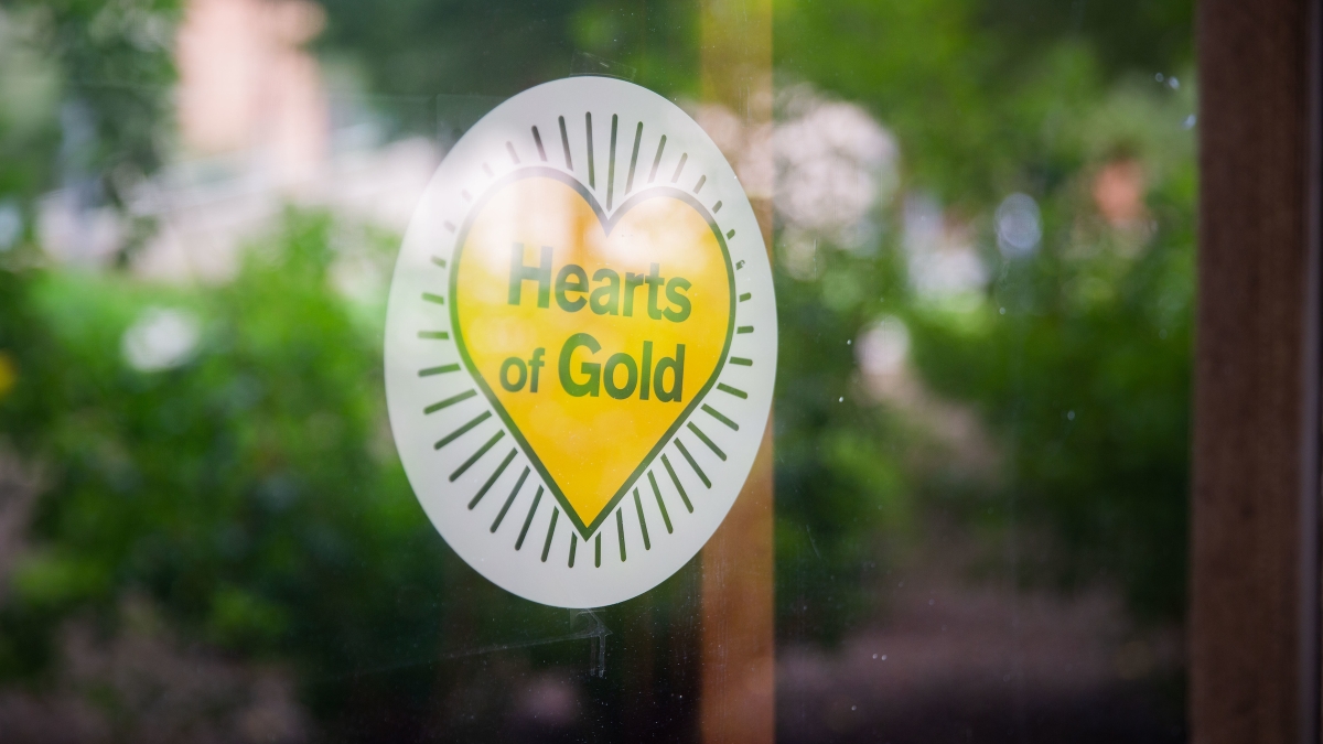 decal in a window that reads, "Hearts of Gold"