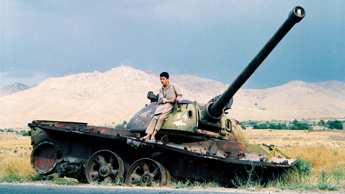 Afghani sitting on tank