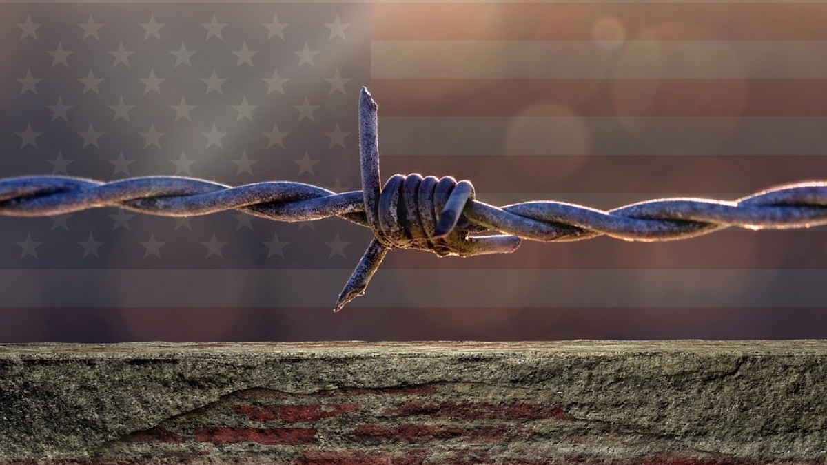 Barbed wire and American flag