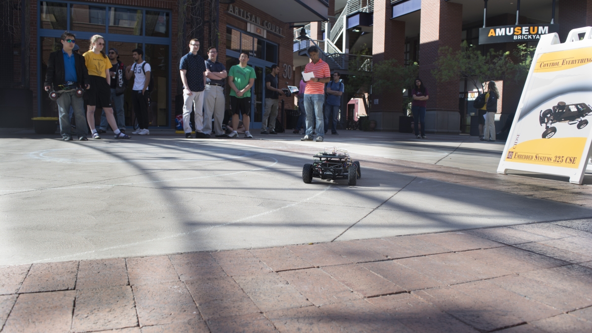 ASU engineering students test a self-driving miniature car.