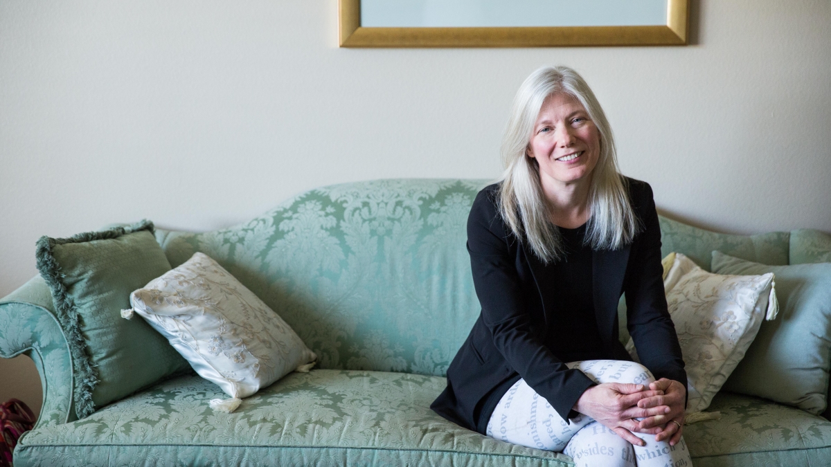 ASU Regents Professor Devoney Looser sitting on a couch