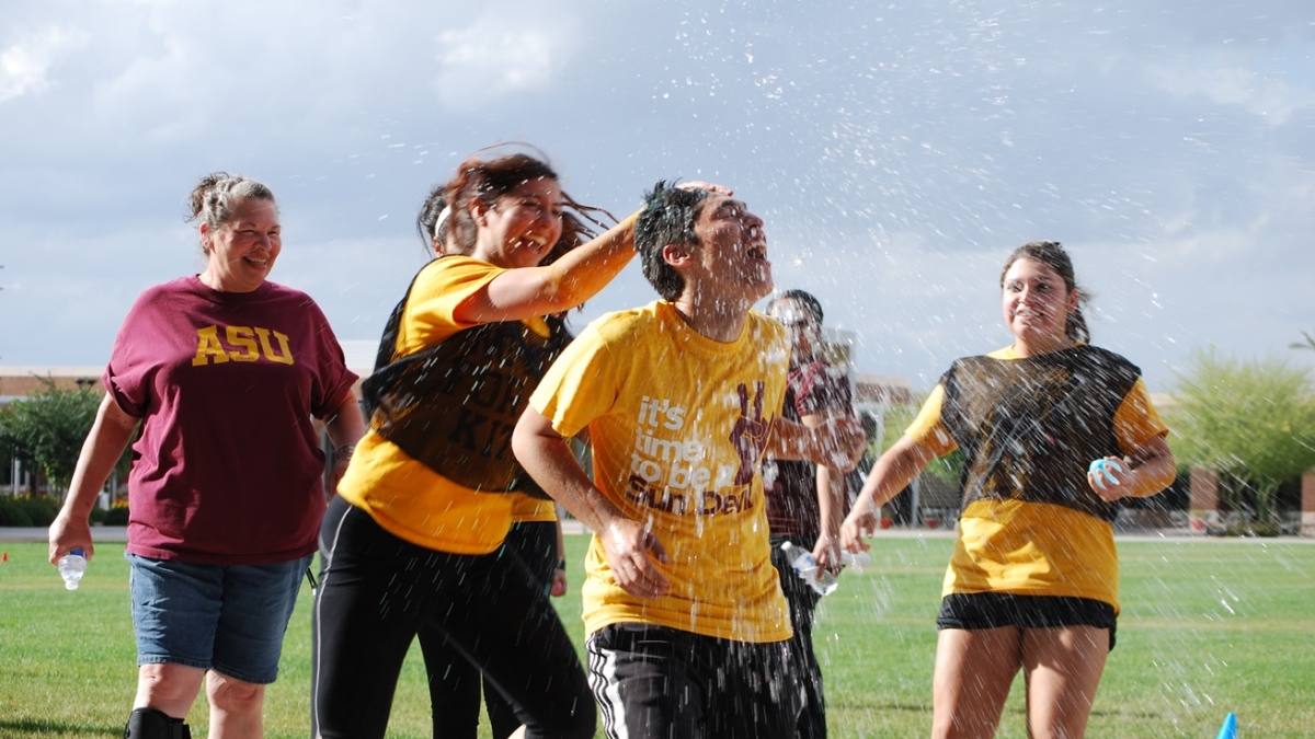students having a water balloon fight